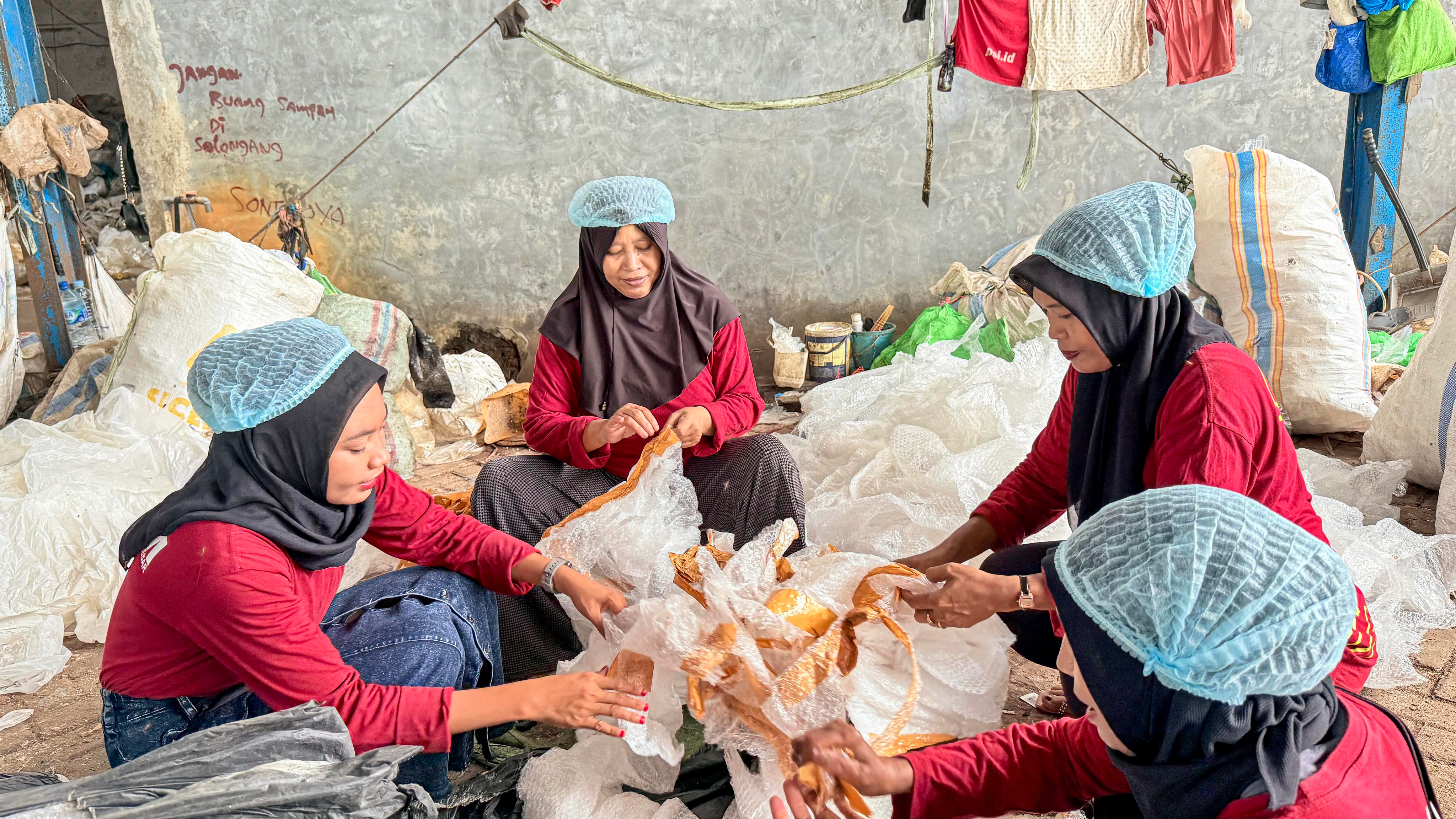 Team sorting recovered plastic at a RECO facility
